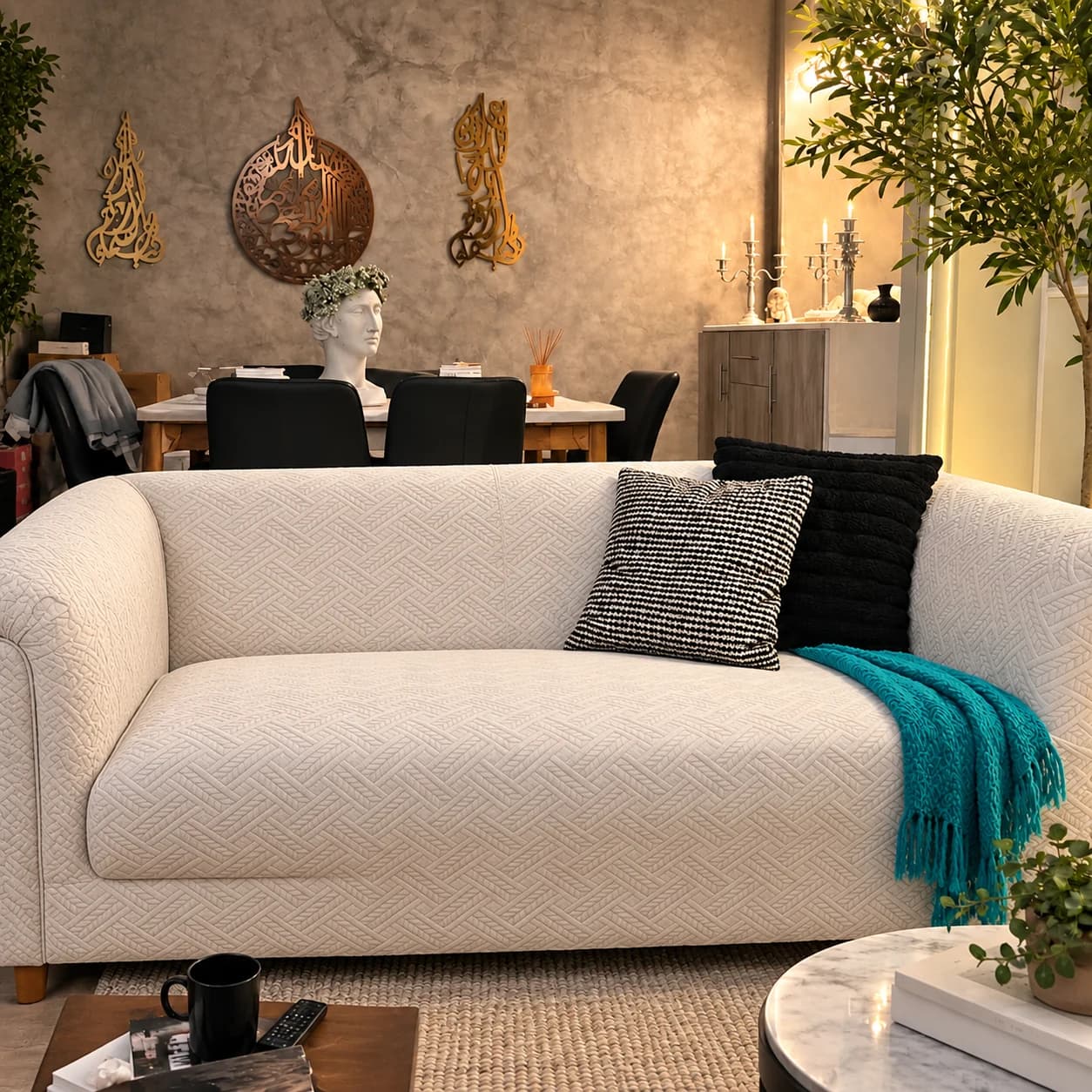 The same sofa dressed in a Luxe cover with cushions and a throw